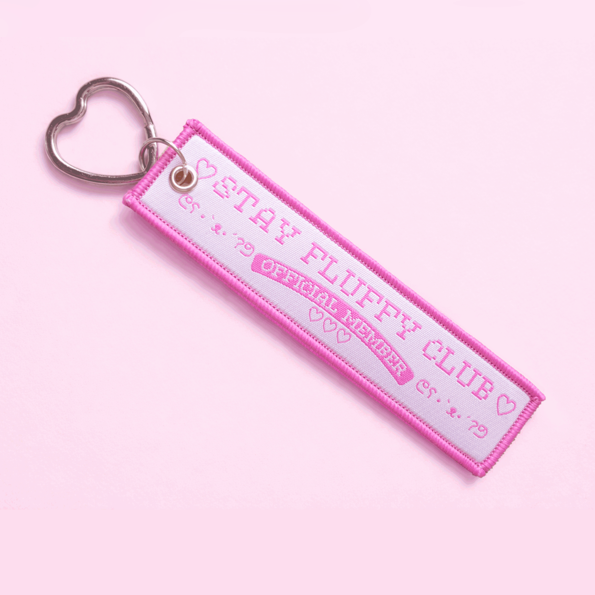 Animated pink and white Stay Fluffy Club member keychain