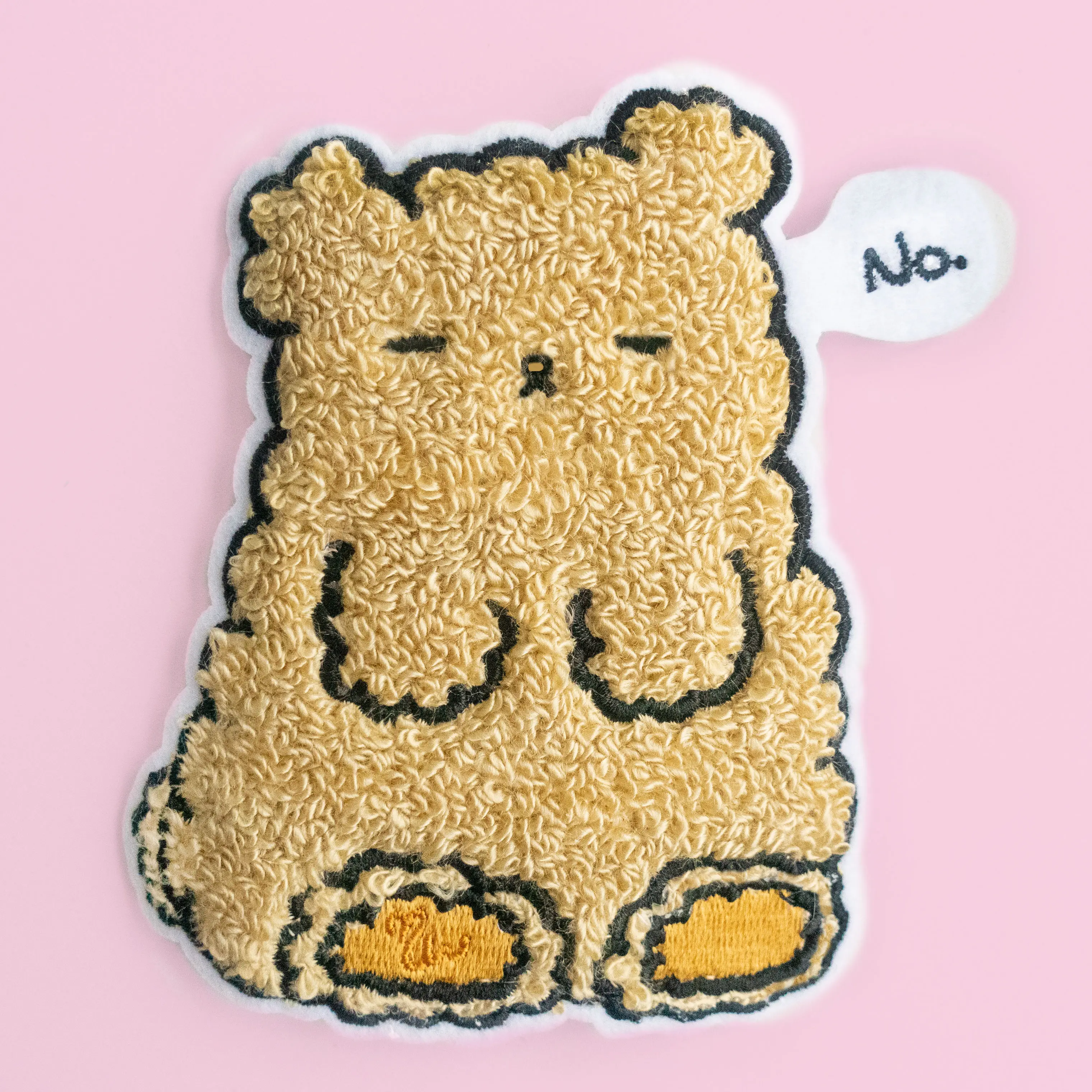 Textured Osito patch with a speech bubble saying no