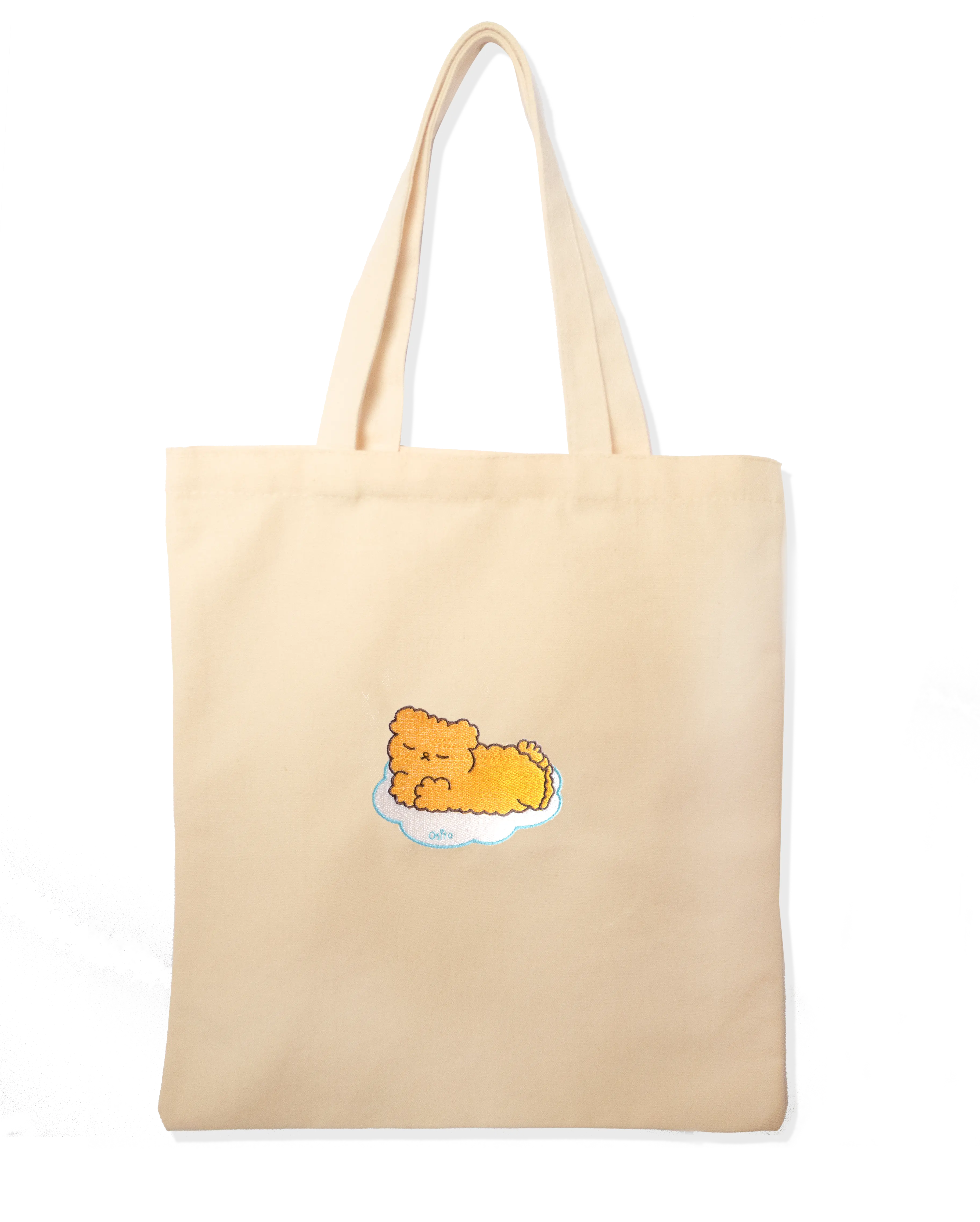 Cream canvas tote bag embroidered with a sleeping Osito